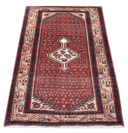 Mahal-style tribal rug, central medallion close-up in red and ivory