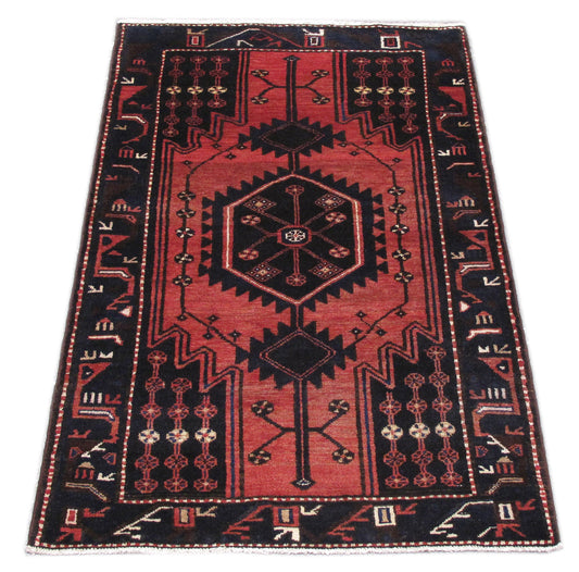 Tribal Hamadan-style small rug, central medallion close-up in ivory and navy