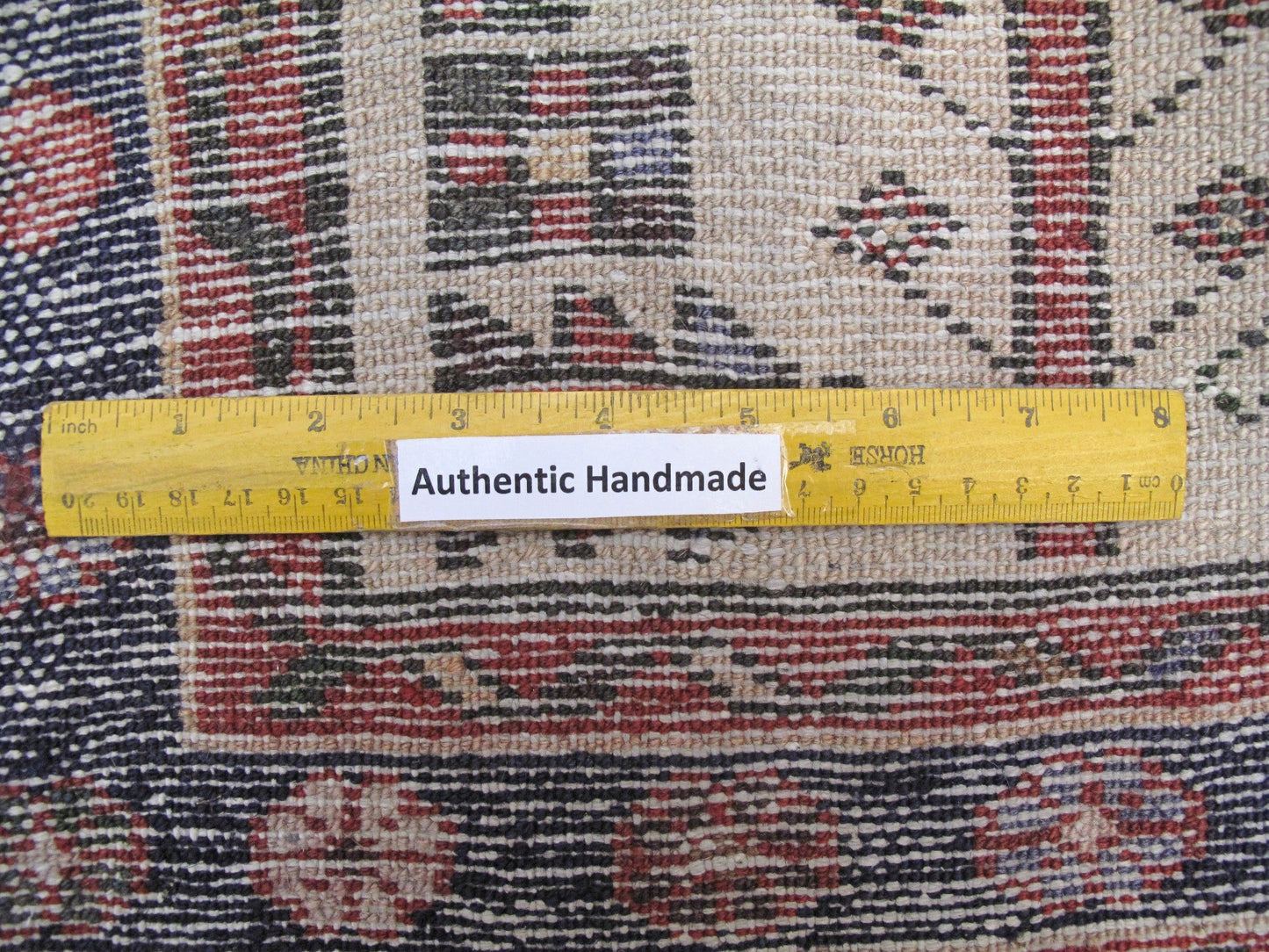 Multi-color Hamadan-style small rug, pile texture and wool depth close-up