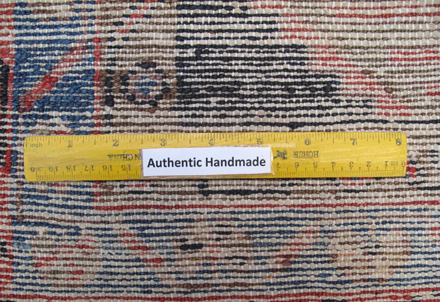 Tribal Hamadan-style small rug, pile texture and color depth close-up