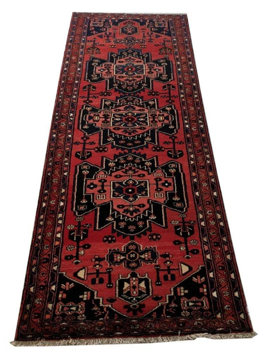 Rust red Hamadan-style runner, central medallion detail