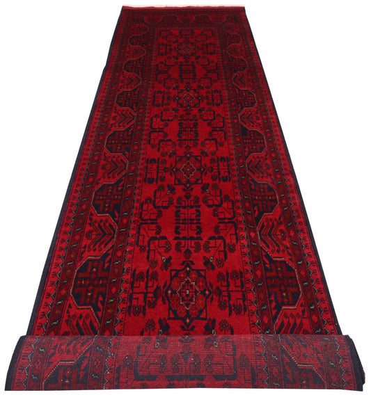 Khal Mohammadi runner, repeating tribal medallion detail in dark red and black