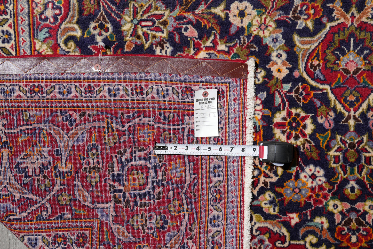 Kashan-style navy rug, wide alternate-angle full layout