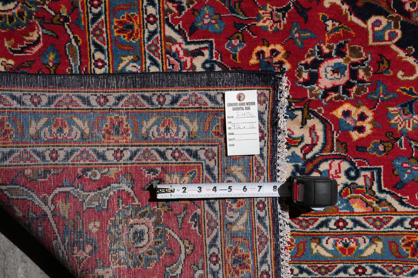 Signed Kashan-style navy rug, wide alternate-angle full layout