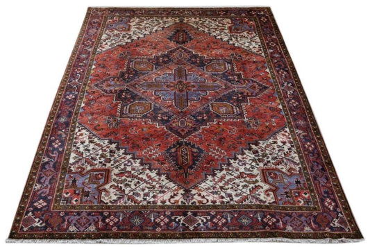Classic Heriz-style wool rug, central medallion close-up in brick red, navy, and ivory