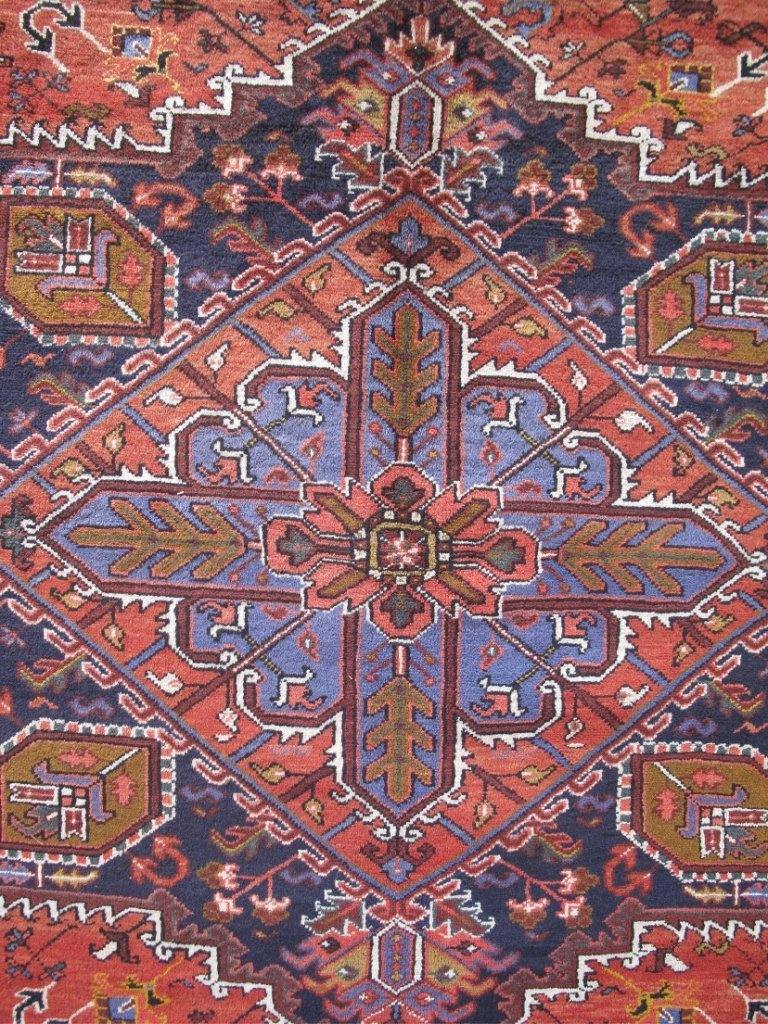 Classic Heriz-style wool rug, tribal corner motif detail
