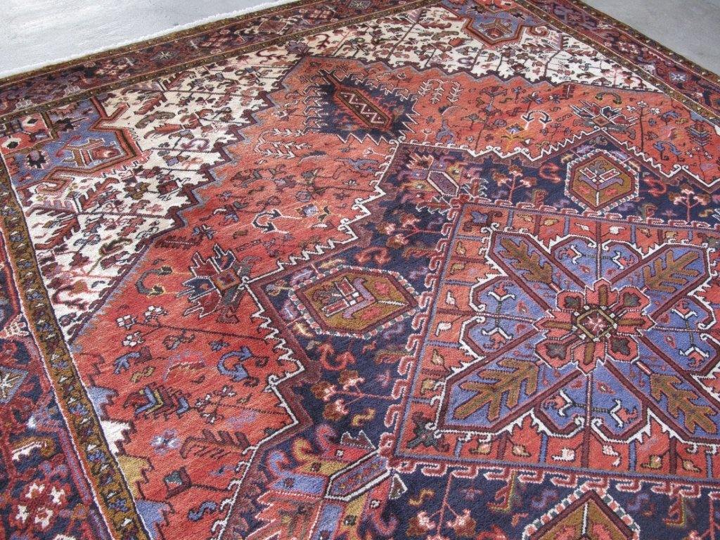 Classic Heriz-style wool rug, geometric pattern across the field