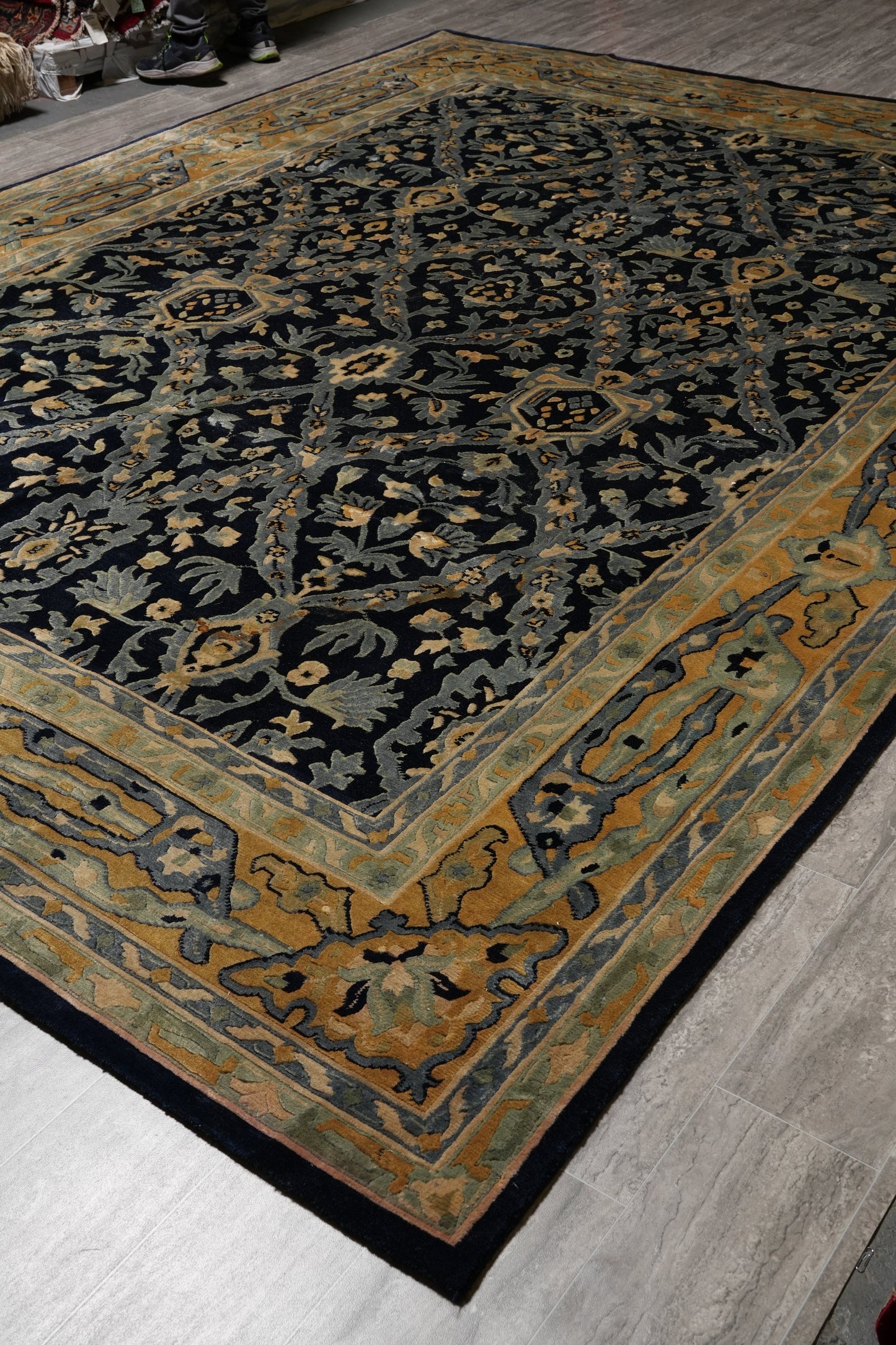 Nepali dark blue rug, border pattern in gold accents