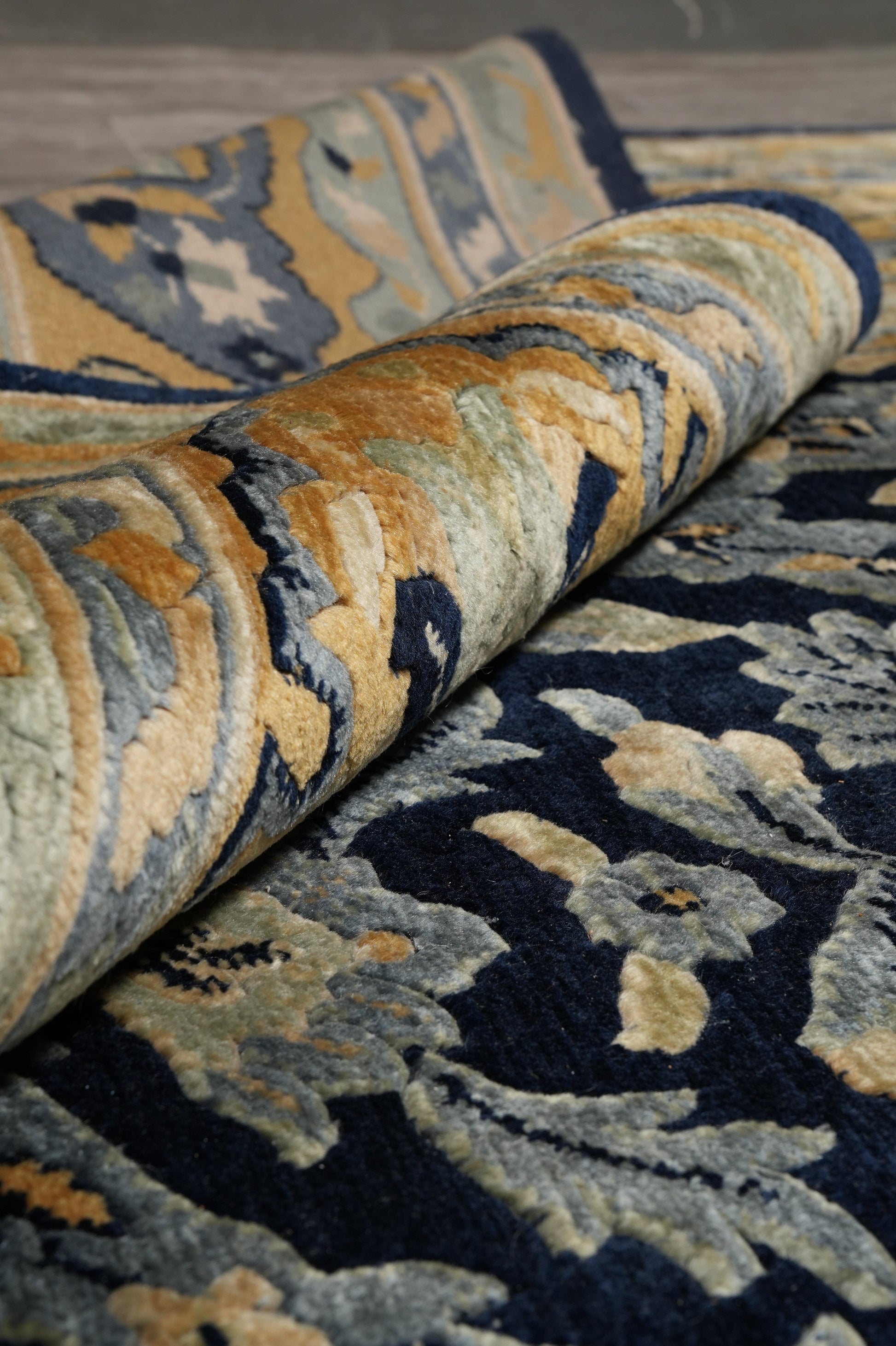 Nepali dark blue rug, color balance close-up of dark blue field with gold