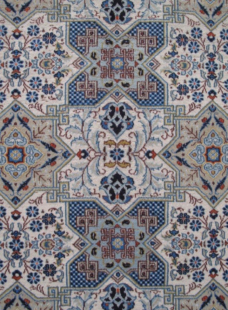 Signed Kashan-style ivory rug, weaver signature panel close-up