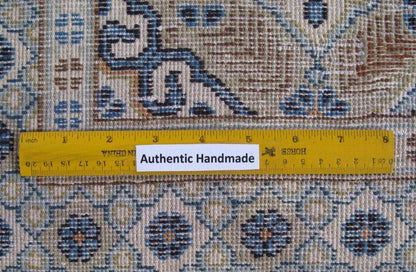 Signed Kashan-style ivory rug, color balance close-up showing ivory field