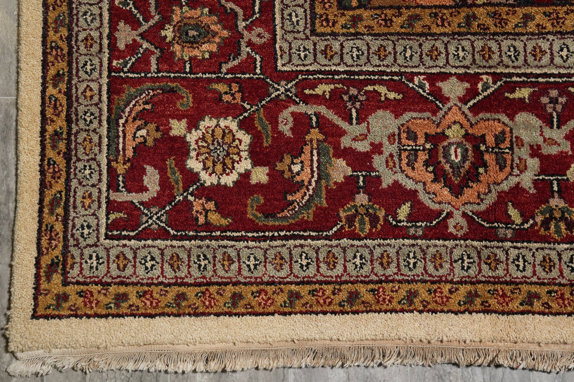 Heriz-Serapi-style wool rug, partial top view showing color balance