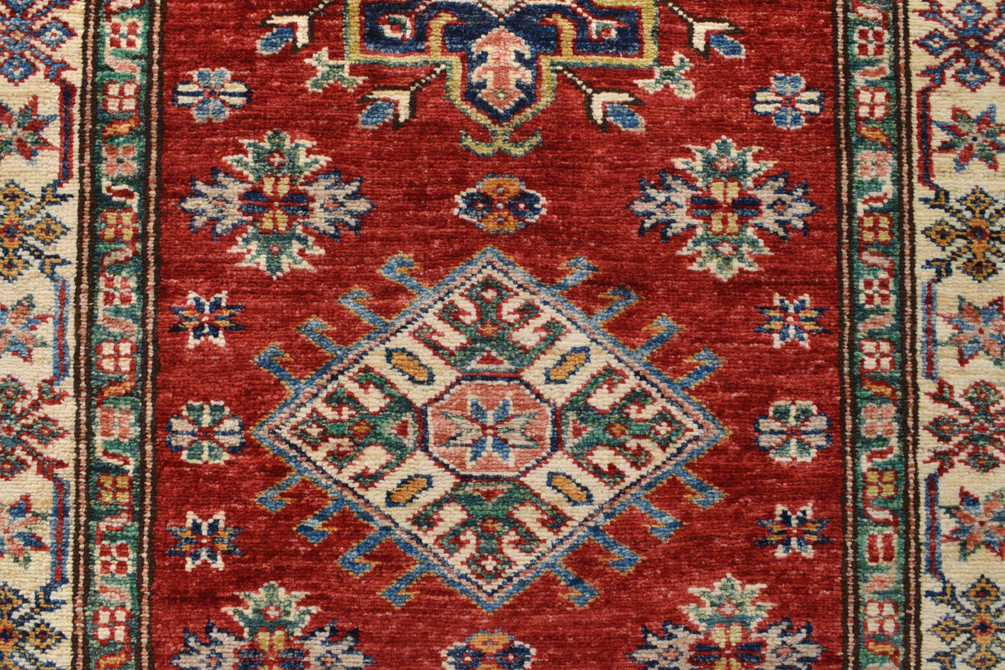 Super Kazak runner, border pattern detail in red and ivory