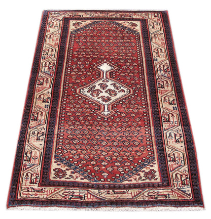 Mahal-style tribal rug, central medallion close-up in red and ivory