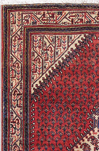 Colorful Mahal-style small rug, corner detail with strong tribal geometry