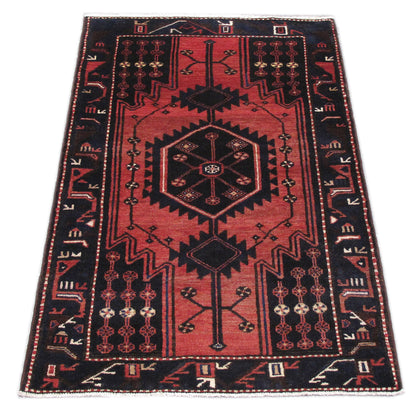 Tribal Hamadan-style small rug, central medallion close-up in ivory and navy
