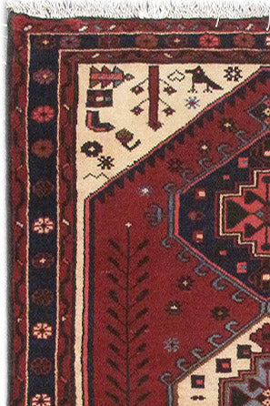 Multi-color Hamadan-style small rug, corner detail with tribal geometry