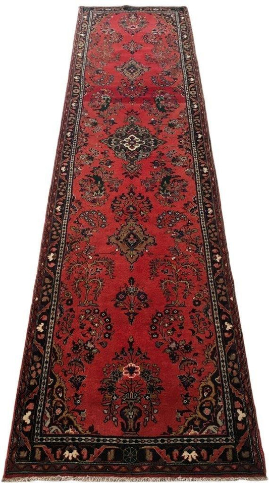 Hamadan-style long runner, central medallion detail in red and ivory