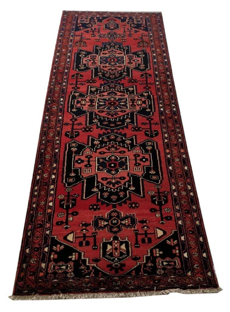 Rust red Hamadan-style runner, central medallion detail