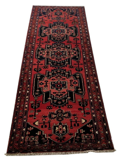 Rust red Hamadan-style runner, central medallion detail