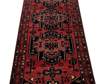Rust red Hamadan-style runner, mid-length pattern detail