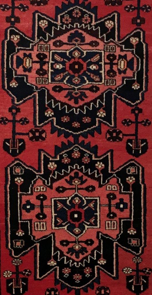 Rust red Hamadan-style runner, border pattern in ivory and navy