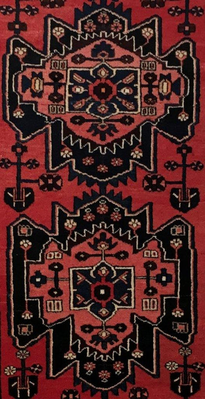 Rust red Hamadan-style runner, border pattern in ivory and navy