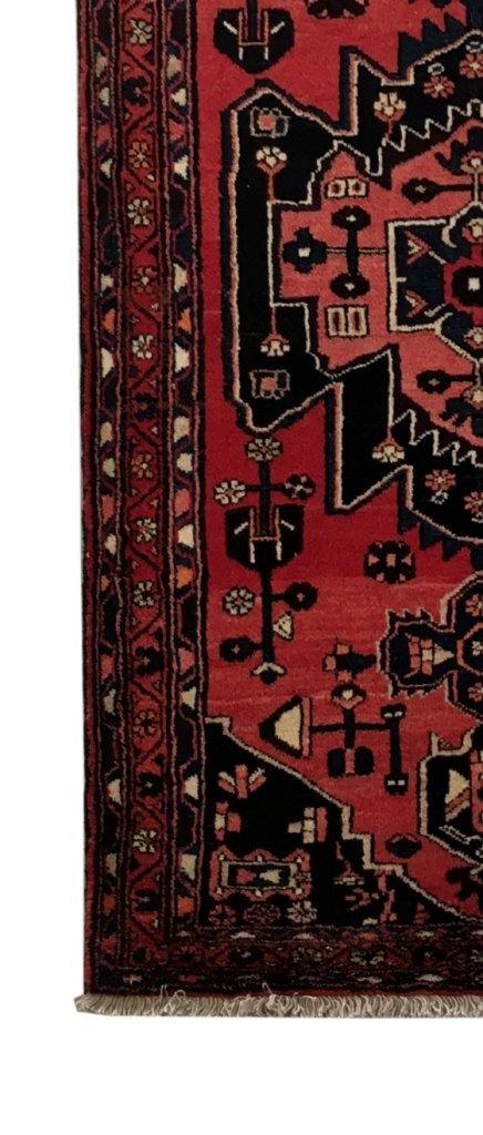 Rust red Hamadan-style runner, end-finish and fringe close-up