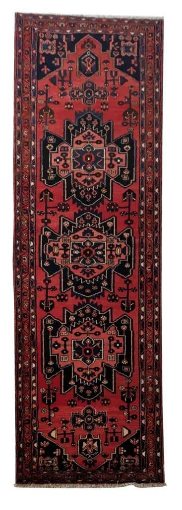 3.9 x 10 Hamadan-style hand-knotted wool runner in rust red, full length top view