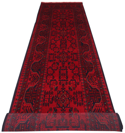Khal Mohammadi runner, repeating tribal medallion detail in dark red and black