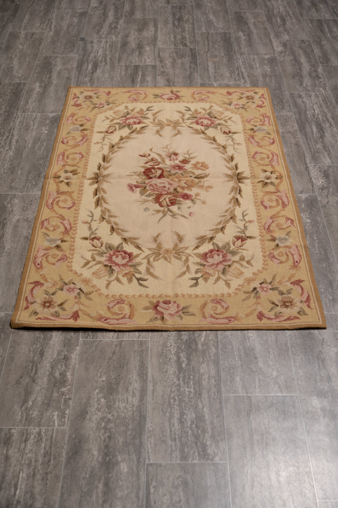 Aubusson needlepoint small rug, central floral motif close-up