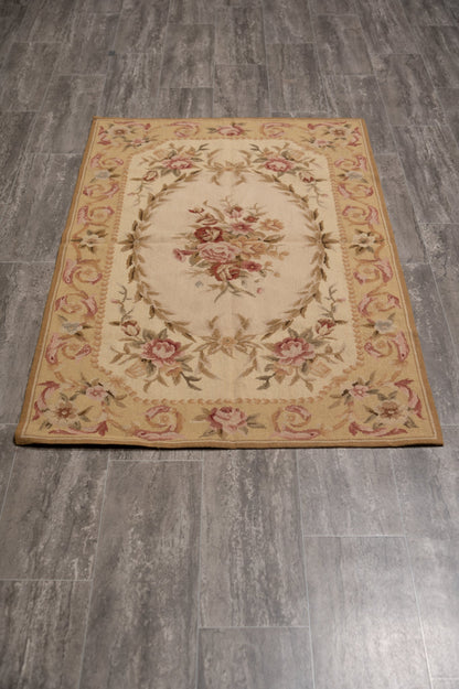 Aubusson needlepoint small rug, central floral motif close-up