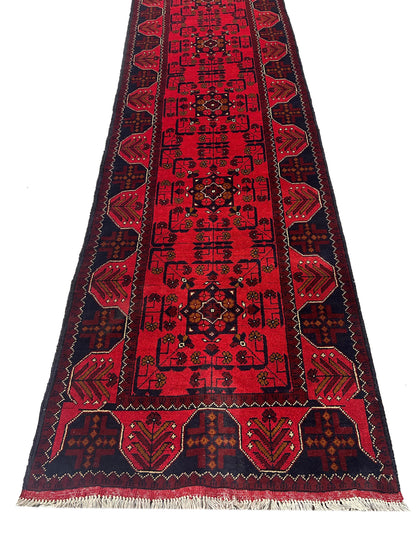 Afghan wool runner, repeating tribal medallion detail in deep red