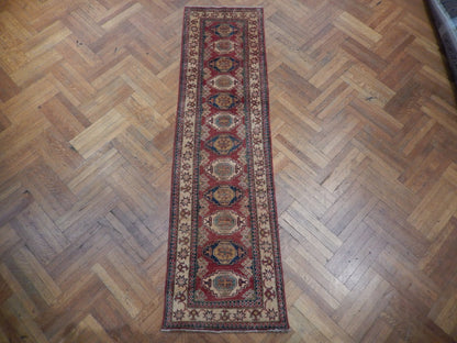 Kazak runner, central medallion detail with tribal geometry