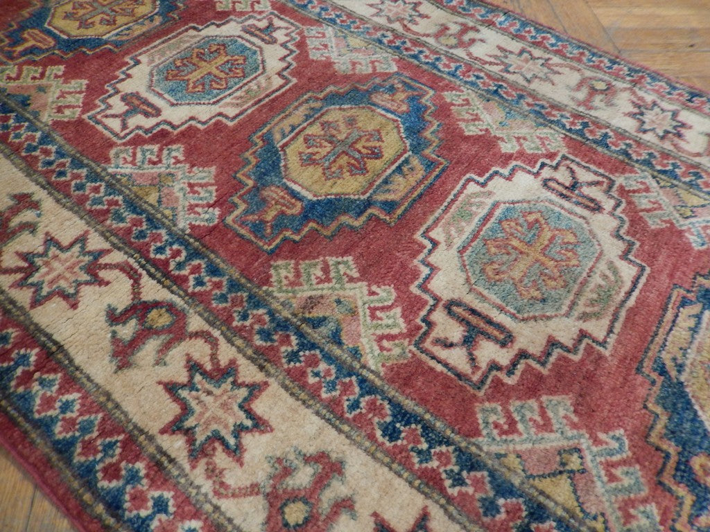 Kazak runner, border pattern detail with multi-color motifs