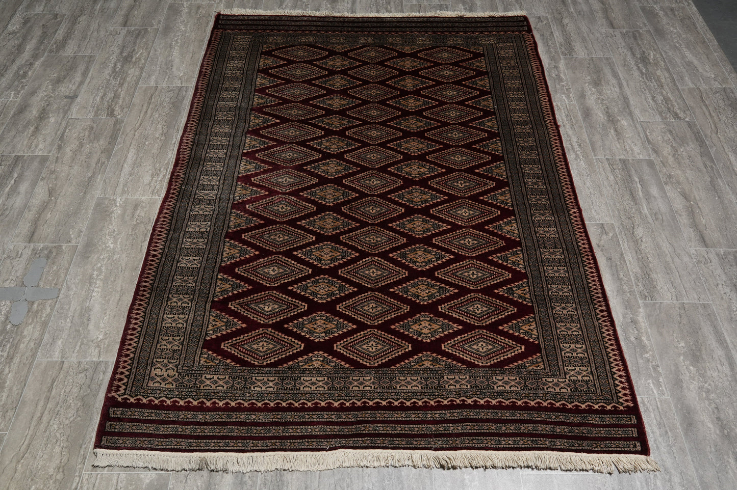 4.3 x 6.5 hand-knotted jaldar bokhara wool rug, corner detail