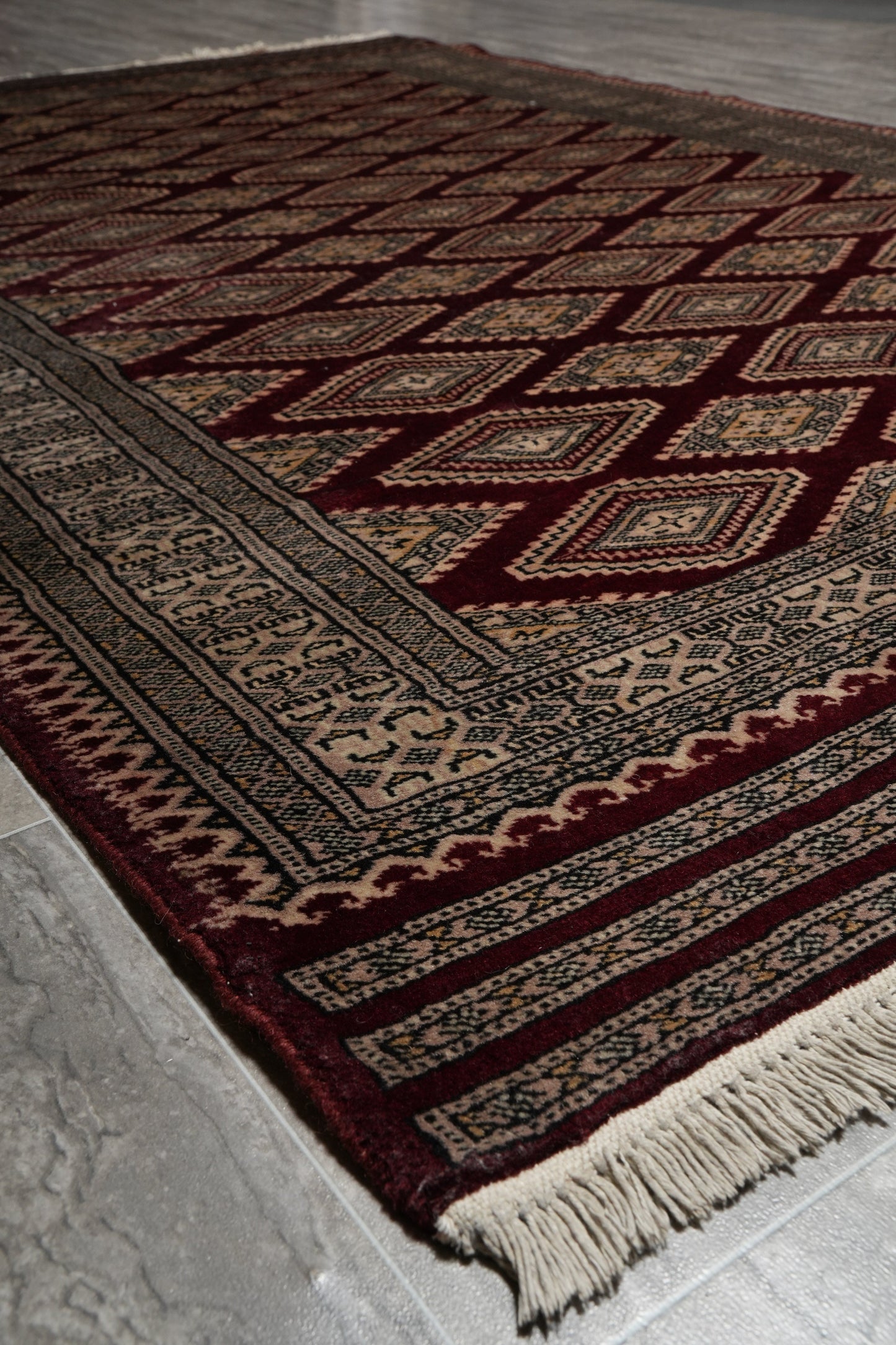 4.3 x 6.5 hand-knotted jaldar bokhara wool rug, alternate angle 1