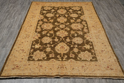 Chocolate brown Chobi rug, ivory border pattern close-up