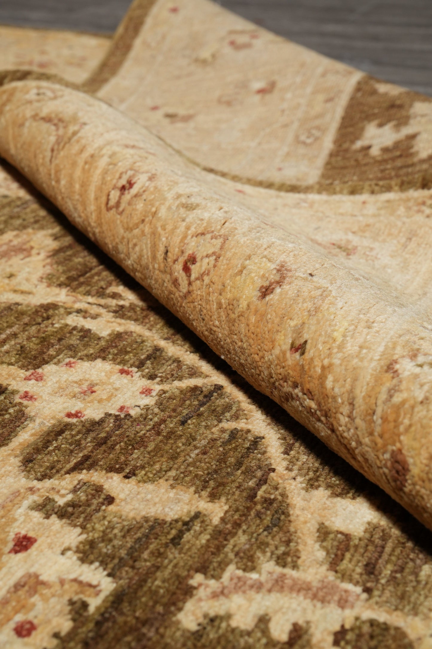 Chocolate brown Chobi rug, mid-field detail close-up