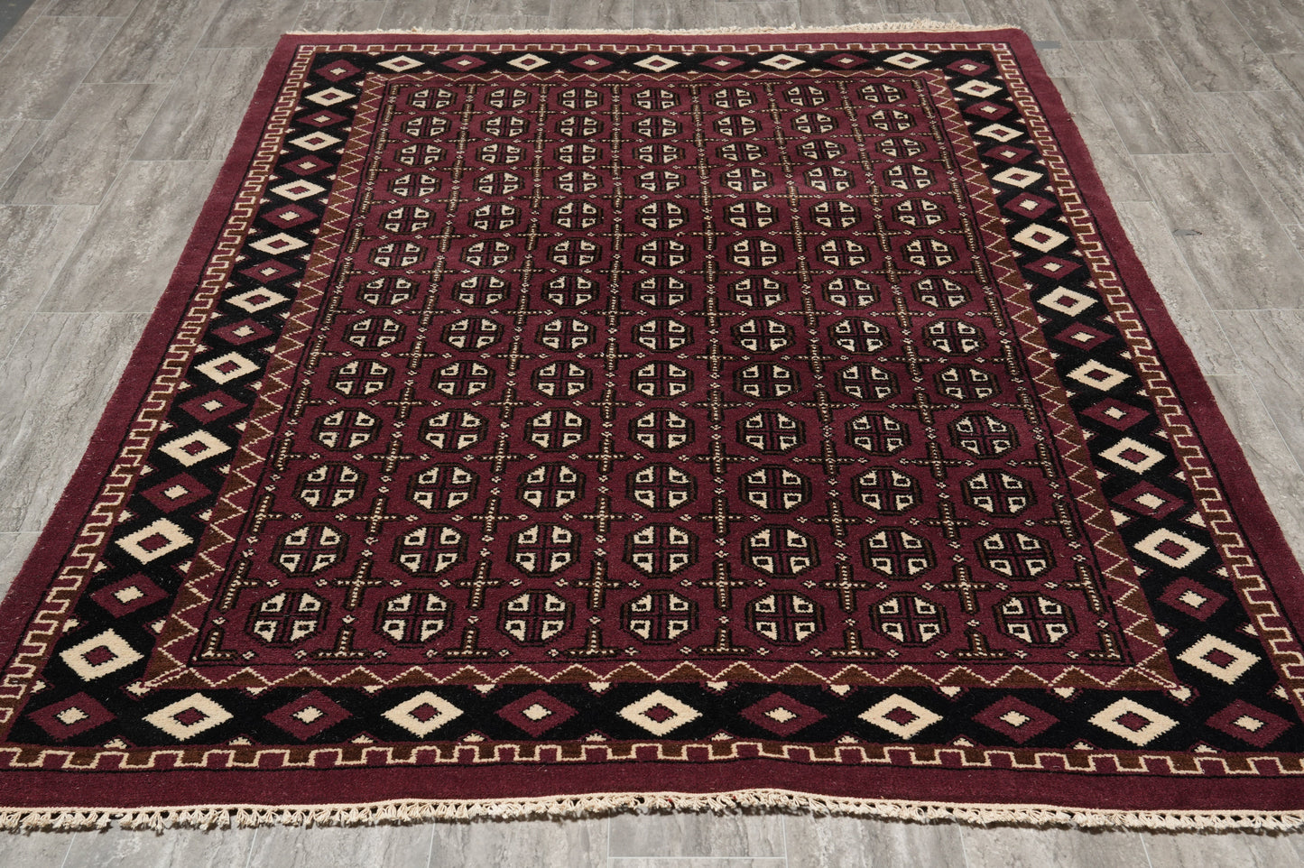 Turkman Bokhara burgundy rug, repeating motif detail