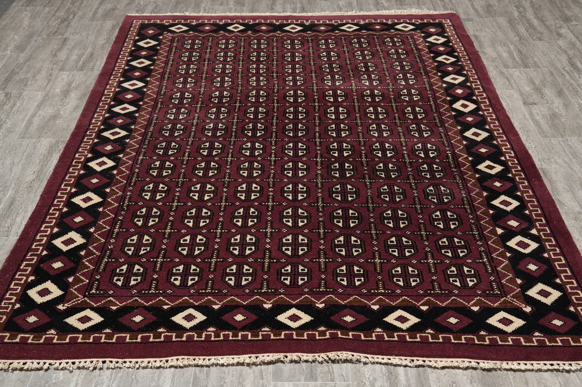 Turkman Bokhara burgundy rug, repeating motif detail