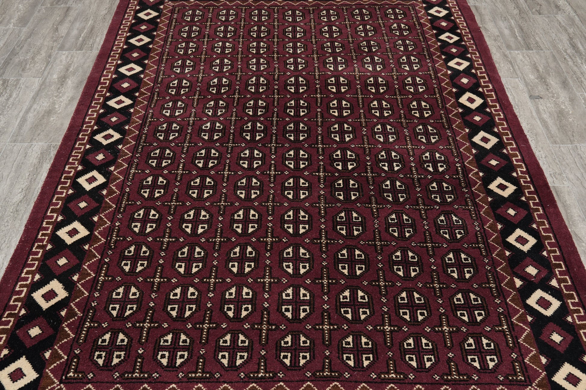 Turkman Bokhara burgundy rug, secondary gul cluster close-up
