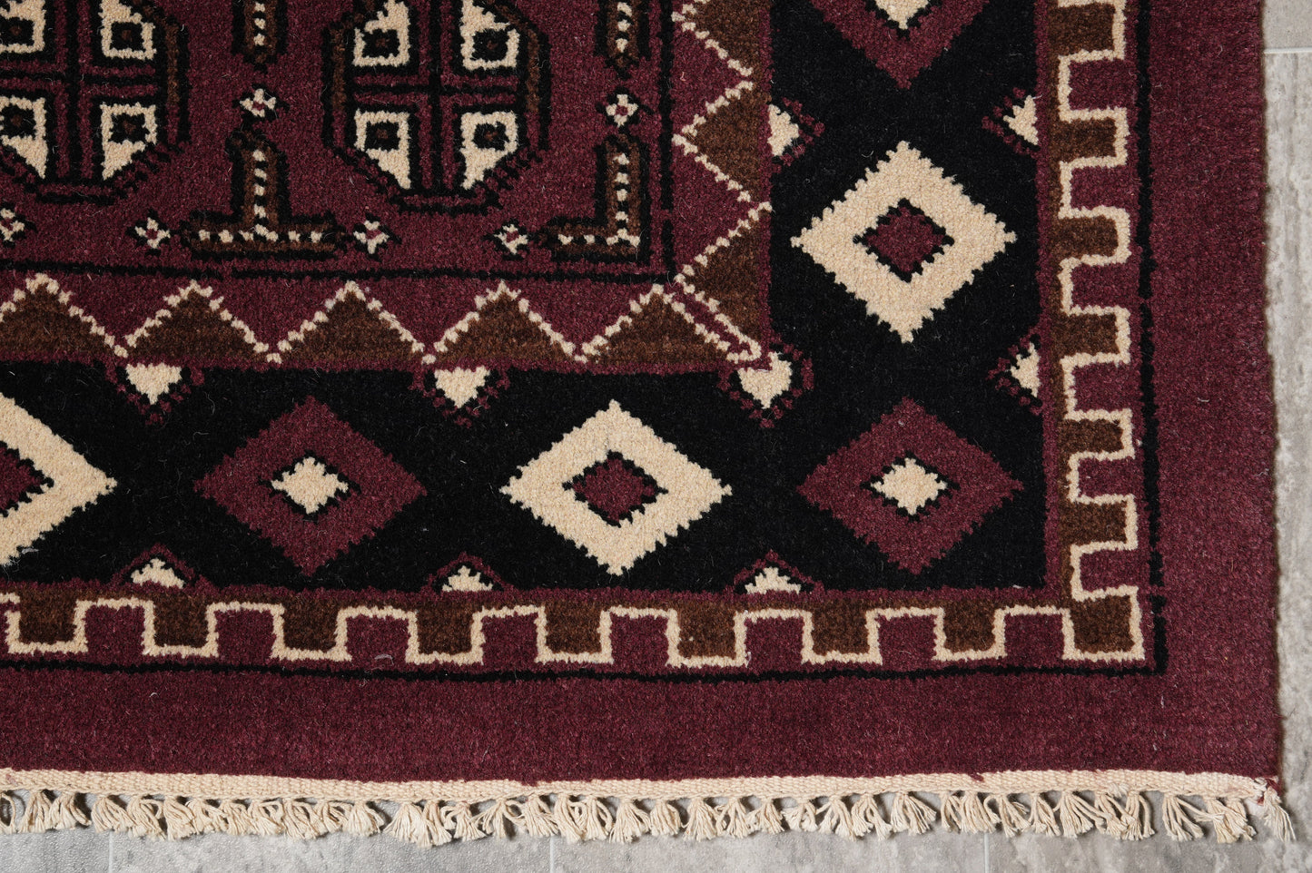 Turkman Bokhara burgundy rug, pile texture showing Turkmen knot density