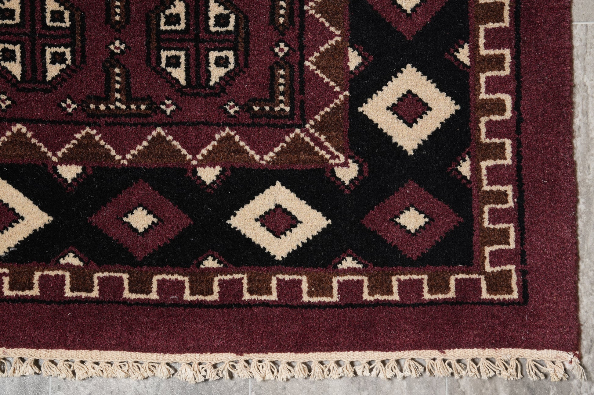Turkman Bokhara burgundy rug, pile texture showing Turkmen knot density