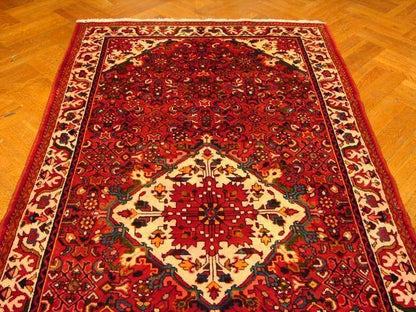 Hamadan-style runner, central medallion detail in red and navy