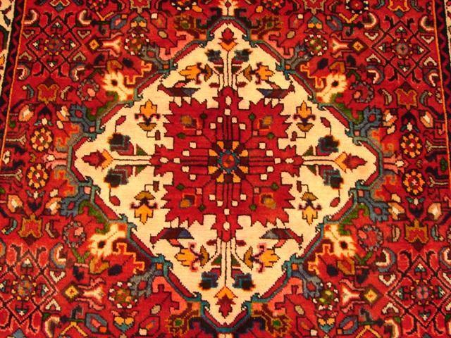 Hamadan-style runner, repeating tribal geometric motif close-up