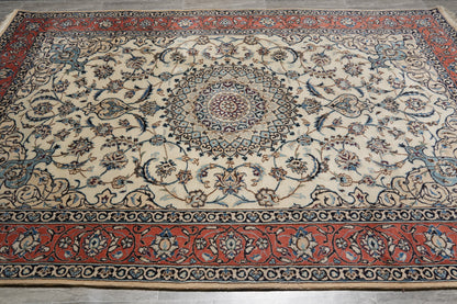 Tabriz-style ivory rug, fine curvilinear pattern detail