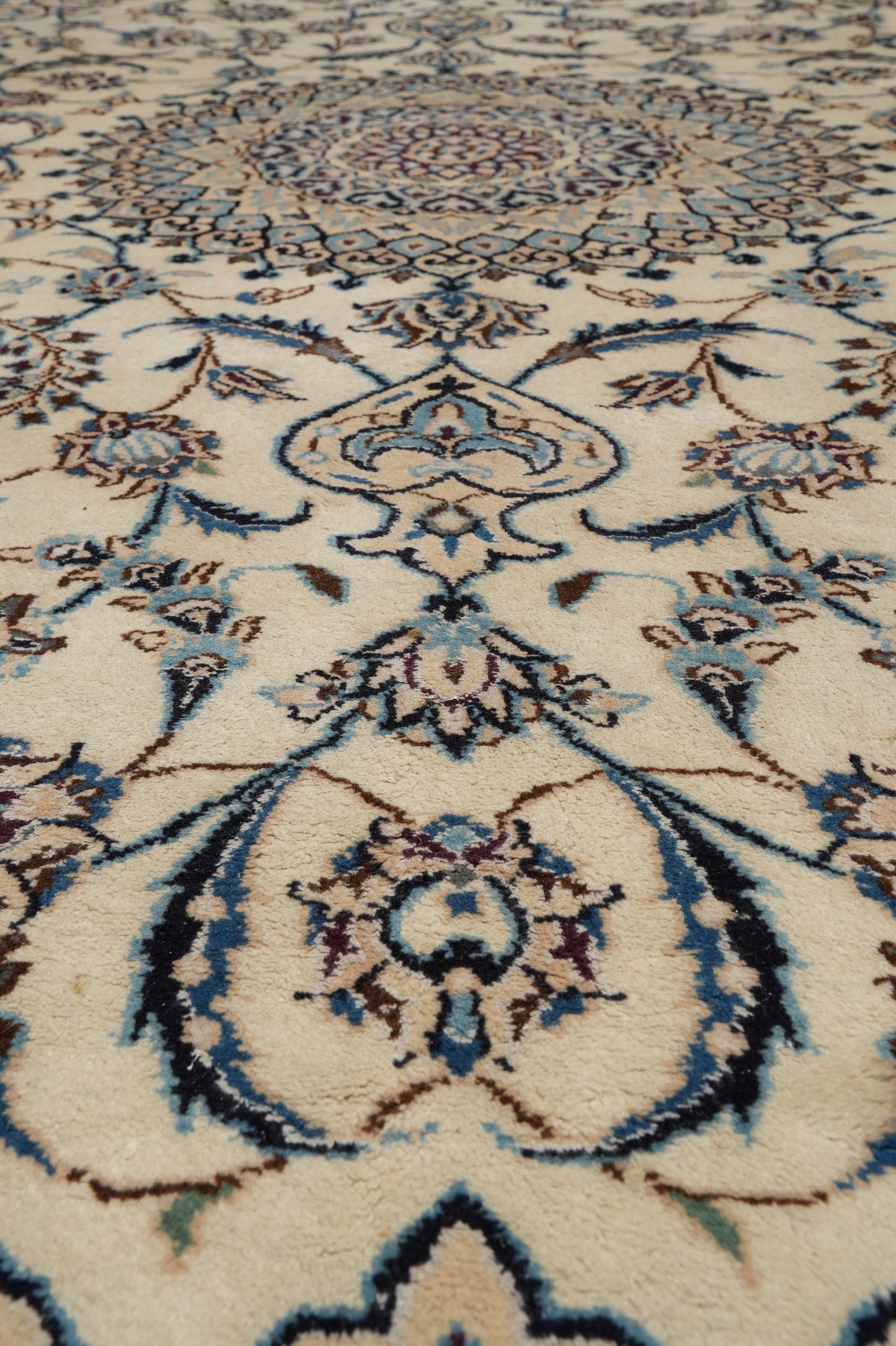 Tabriz-style ivory rug, color balance showing ivory field