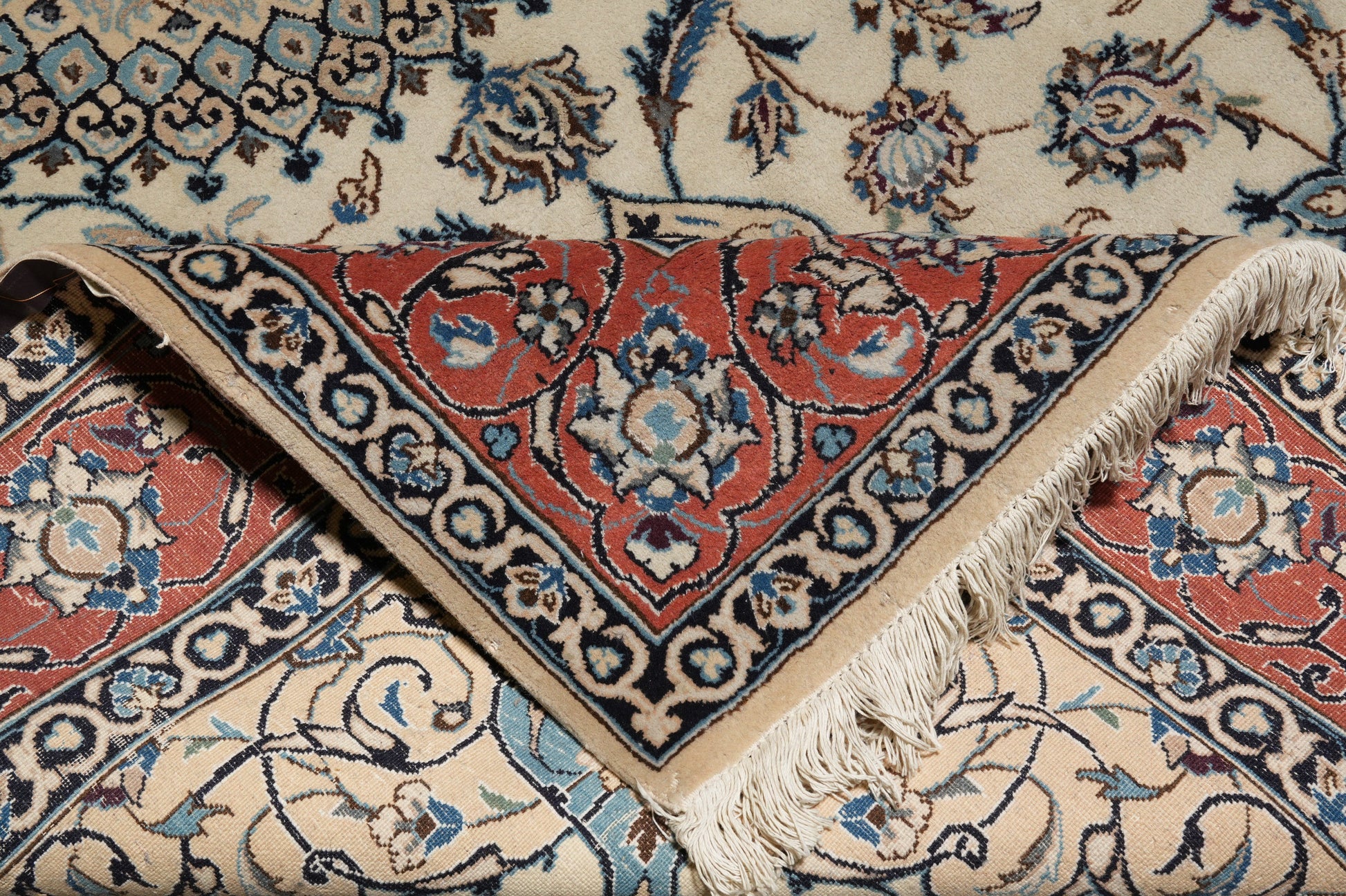 Tabriz-style ivory rug, third floral motif close-up