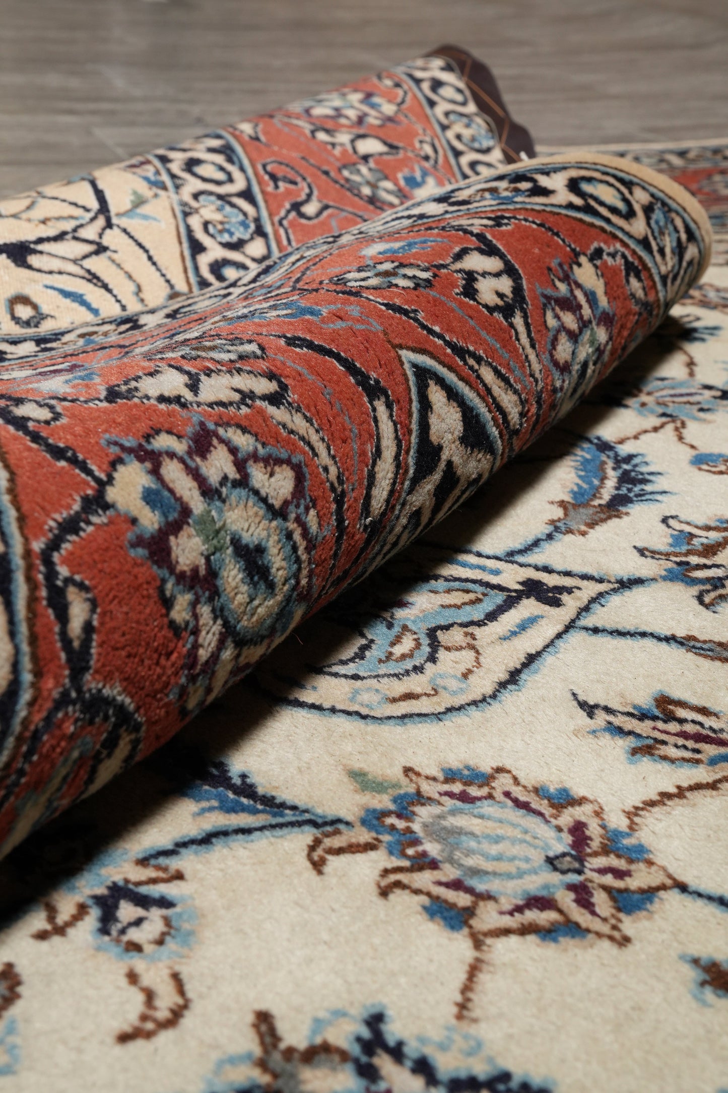 Tabriz-style ivory rug, mid-field detail